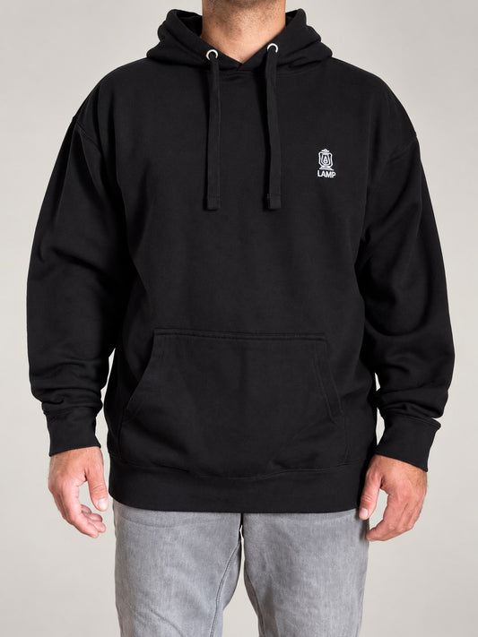 Black LAMP hoodie, front view, with the embroidered LAMP lantern logo on the chest and front pouch pocket