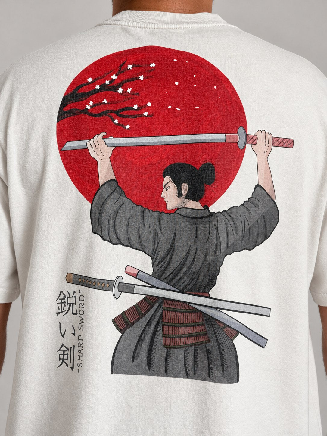 Close-up of the samurai, red sun and Sharp Sword lettering on the back of the Faded Bone tee