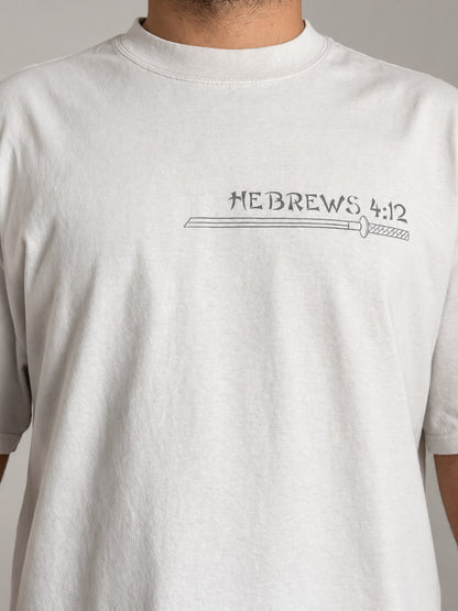 Close-up of the katana and Hebrews 4:12 print on the chest of the Faded Bone tee