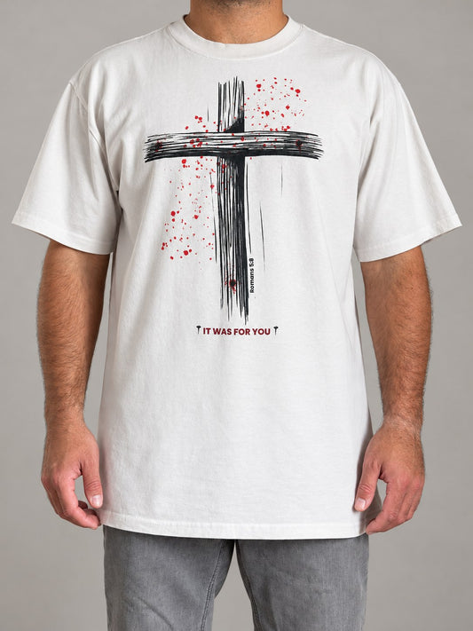 It Was For You tee in Faded Bone worn by a male model, front view, hand-drawn cross with red splatter and Romans 5:8
