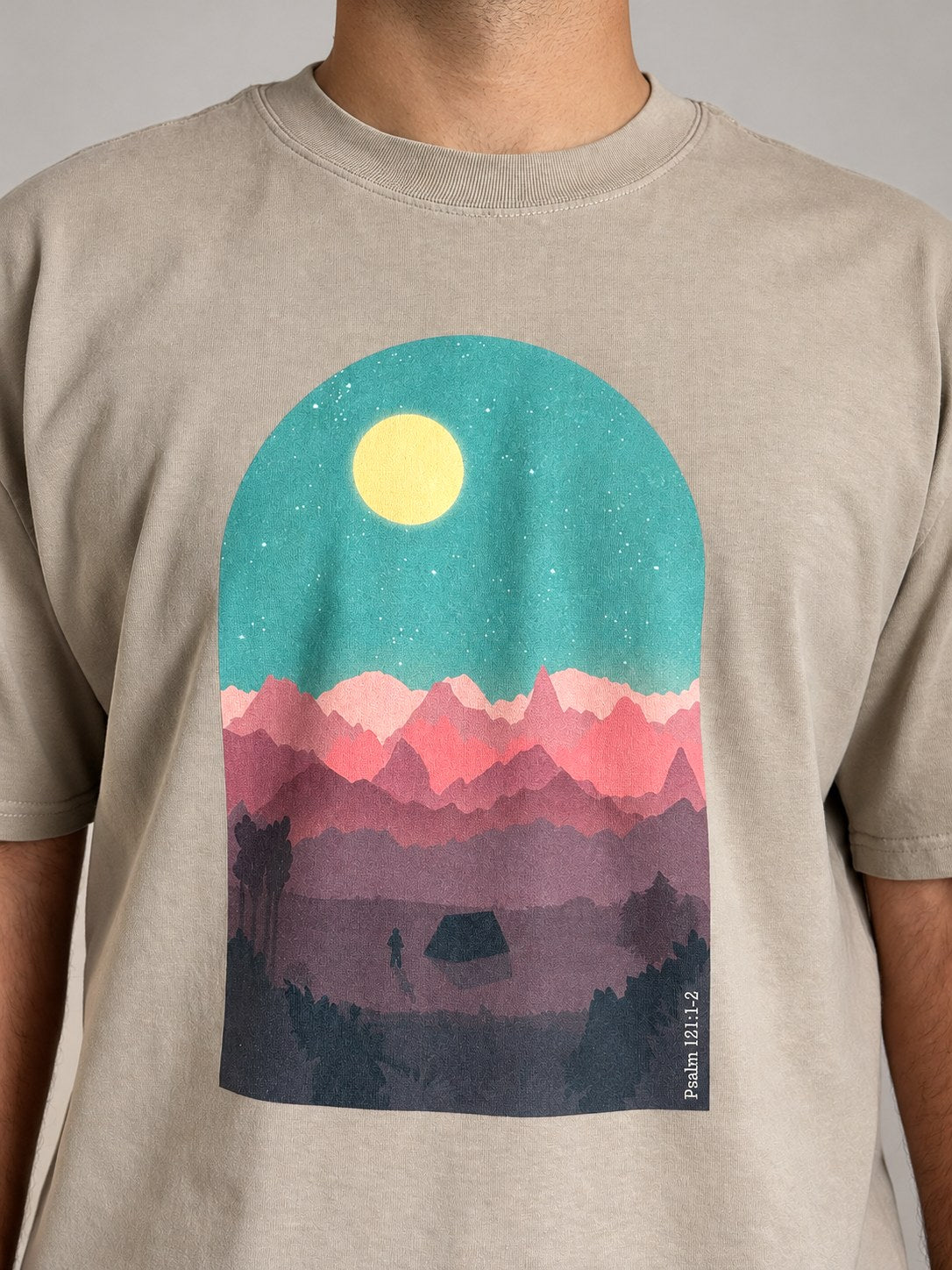 Close-up of the Psalm 121:1-2 print on the Faded Khaki tee: moon, mountains, tent and the verse reference