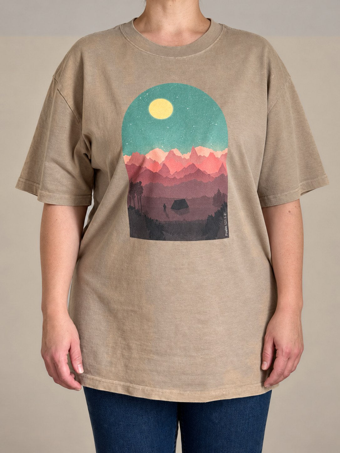 Psalm 121:1-2 oversized faded tee in Faded Khaki, front view on a female model, moonlit mountain scene print
