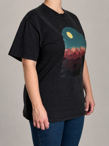 Psalm 121:1-2 tee in Faded Black, three-quarter view on a female model showing the boxy oversized fit