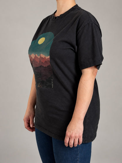 Psalm 121:1-2 tee in Faded Black, side angle on a female model with the dropped shoulders and mountain print